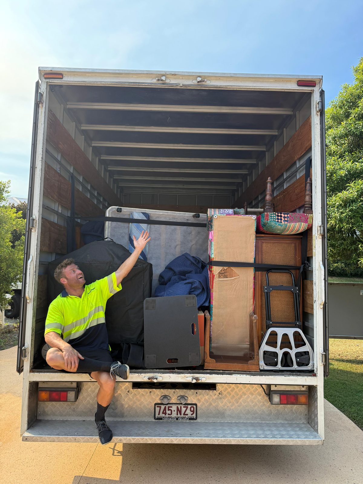 Pickup Pals removalist in the back of a fully packed removal truck